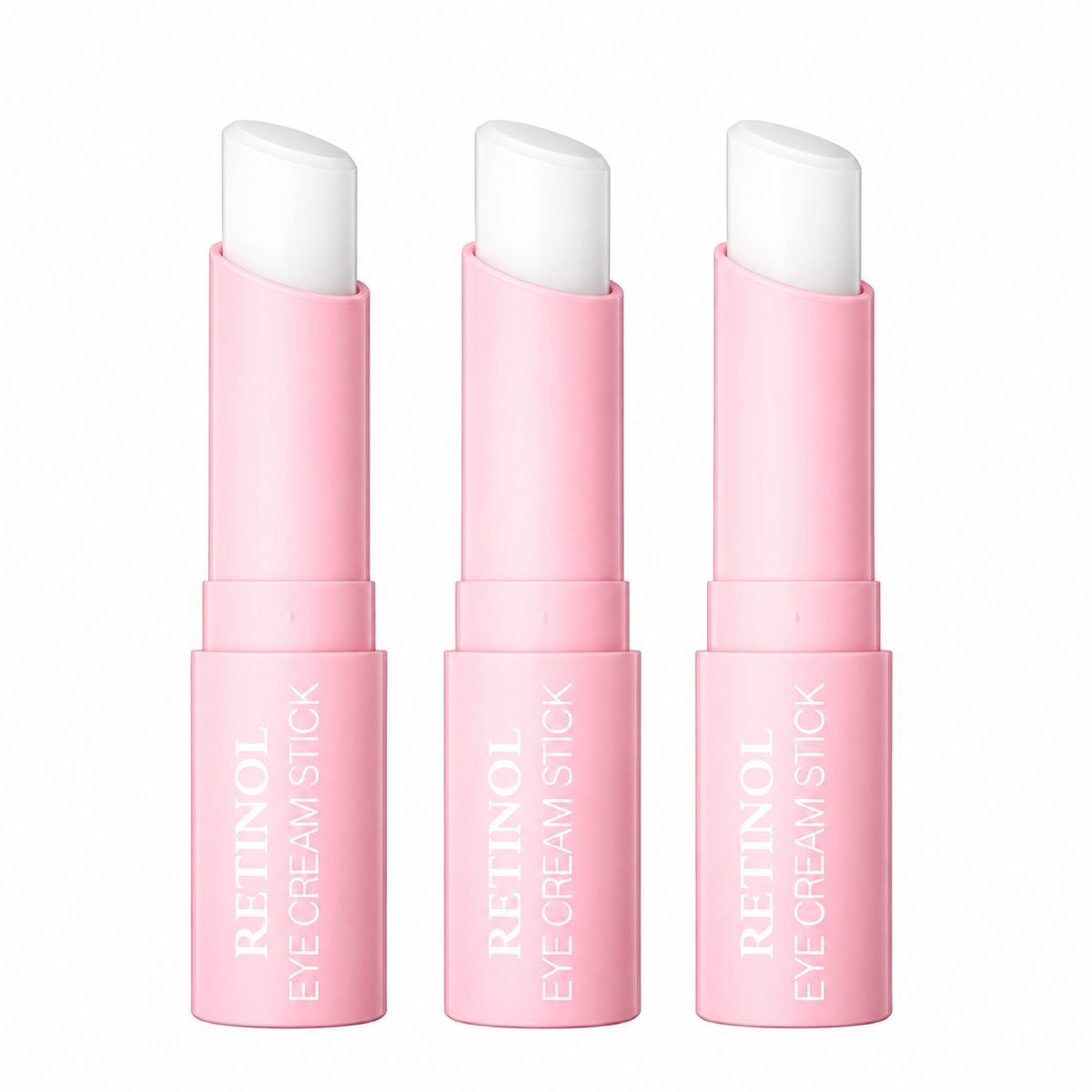 Pink retinol eye cream sticks on white background