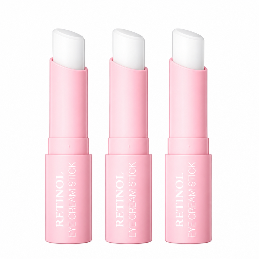 Pink retinol eye cream sticks on white background